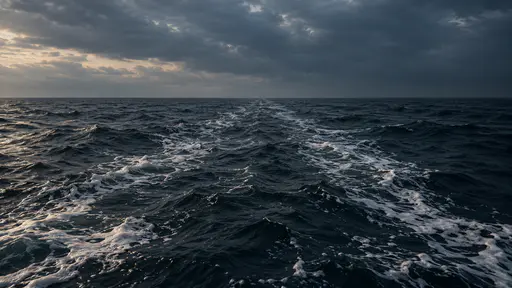 Pale foam traces two converging current lines that meet far ahead in a long narrowing seam of broken water in low dark light.