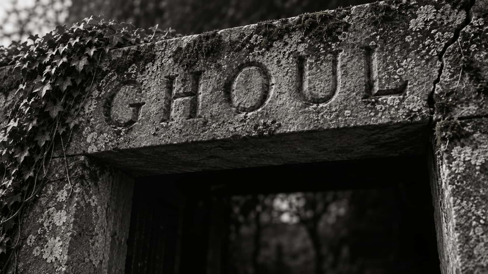 A long worn limestone lintel with the word GHOUL cut in deep V-grooves, lichen and moss in the stone, ivy hanging from the left end and a crack at the right, above a dark gateway.