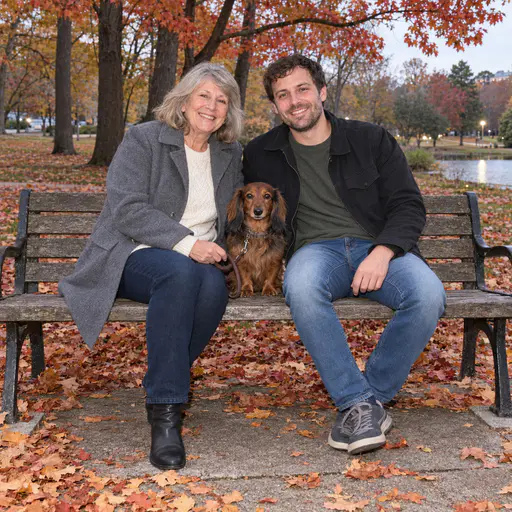 Mother and Son on a Park Bench With Dachshund