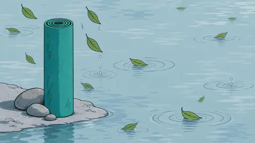 A rolled teal yoga mat stands on its end at the edge of a still pond beside smooth grey stones with green leaves drifting onto calm water and soft ripples.